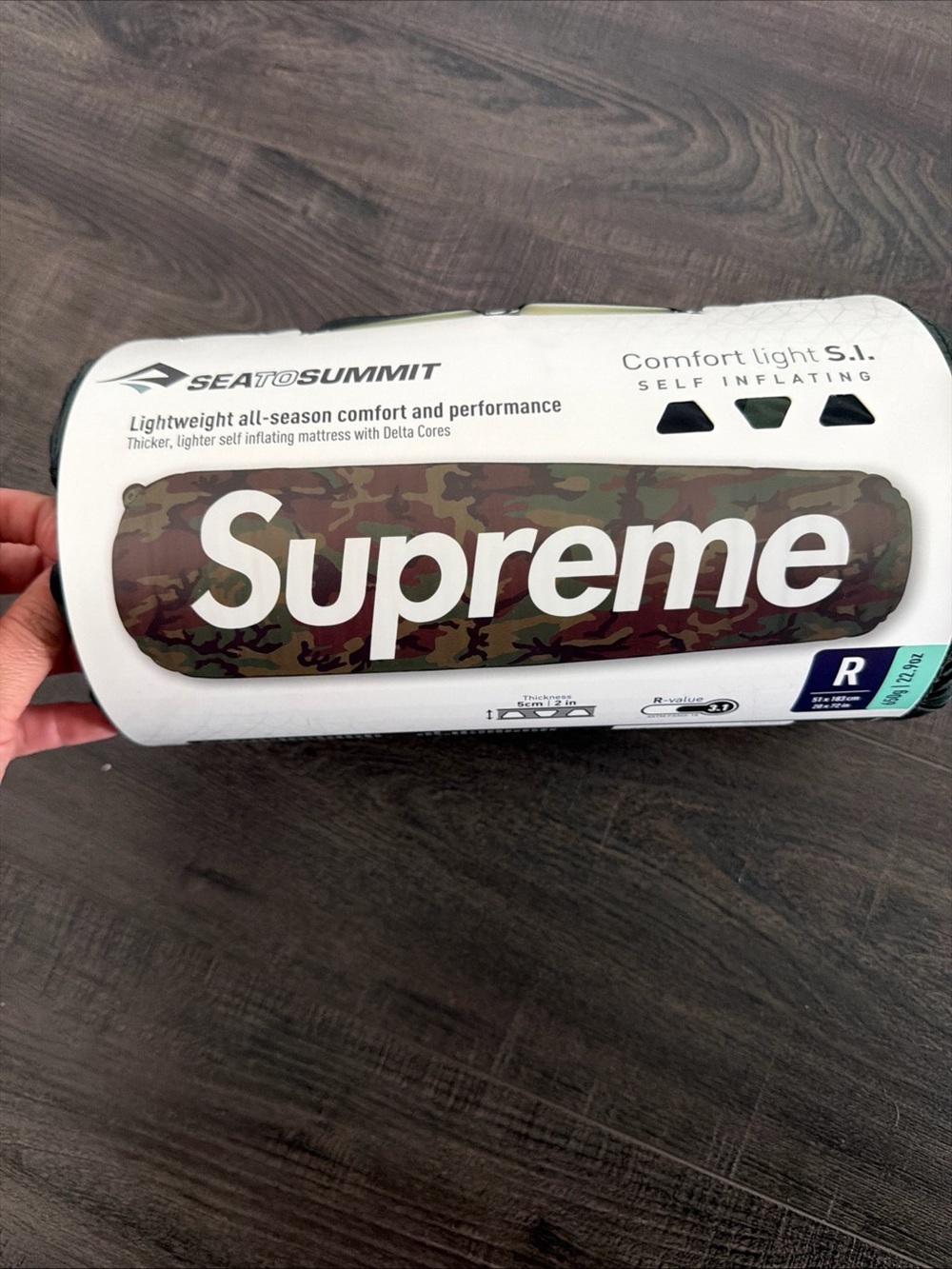 Supreme camo roll-up mat with green and brown tones